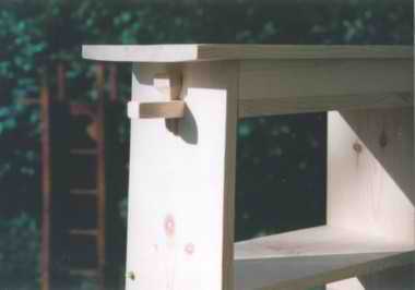 close-up photograph of a pegged tenon in a bookcase