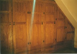 oak and oak veneered ply wardrobe with built-in chests of drawers, 5000