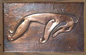 beaten copper panel of Pictish beast